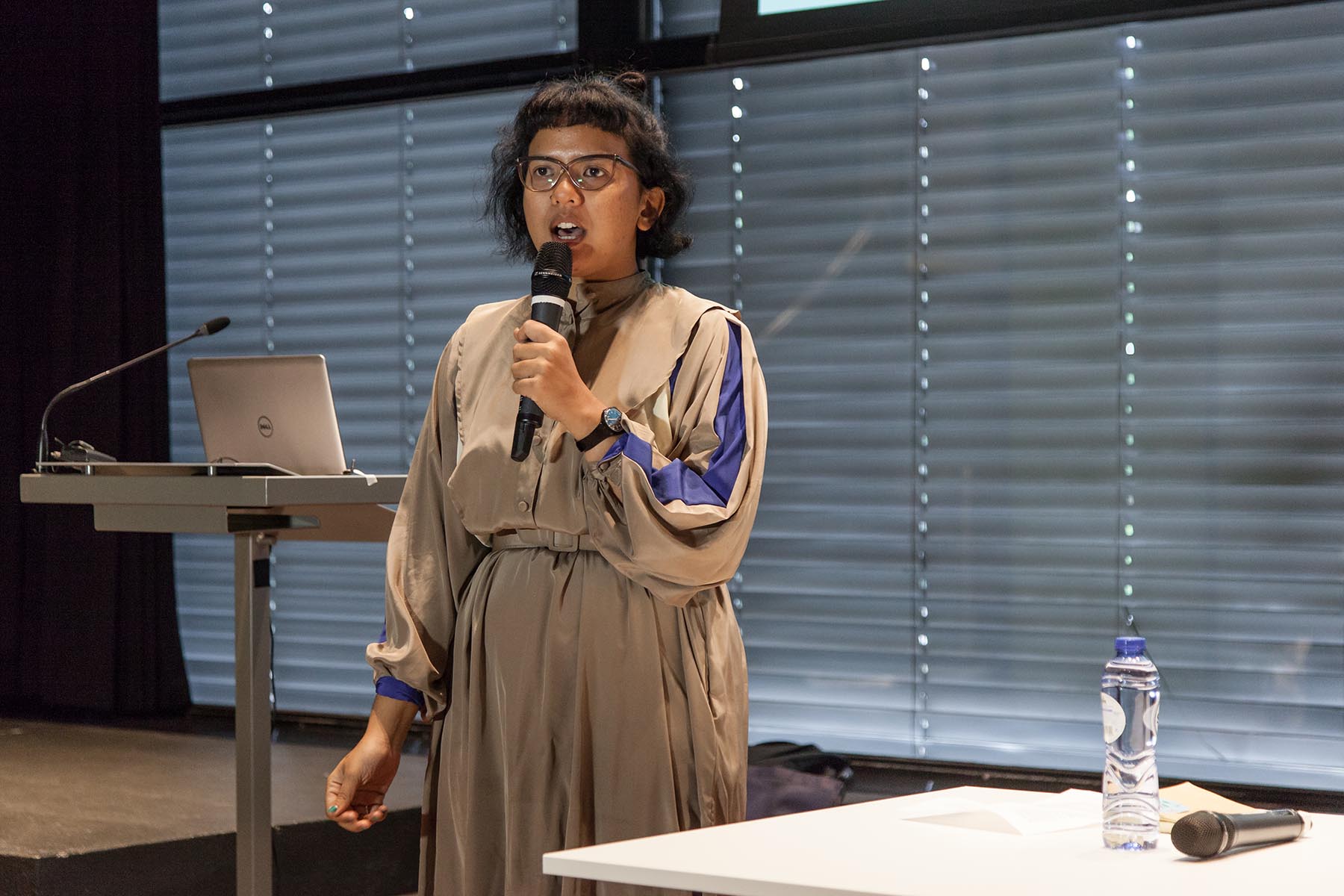 Syafiatudina from KUNCI Cultural Studies Center on listening the archive. Ph: Konstantin Guz